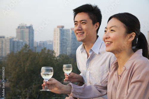 Photography Couple Looking Out Over Cityscape