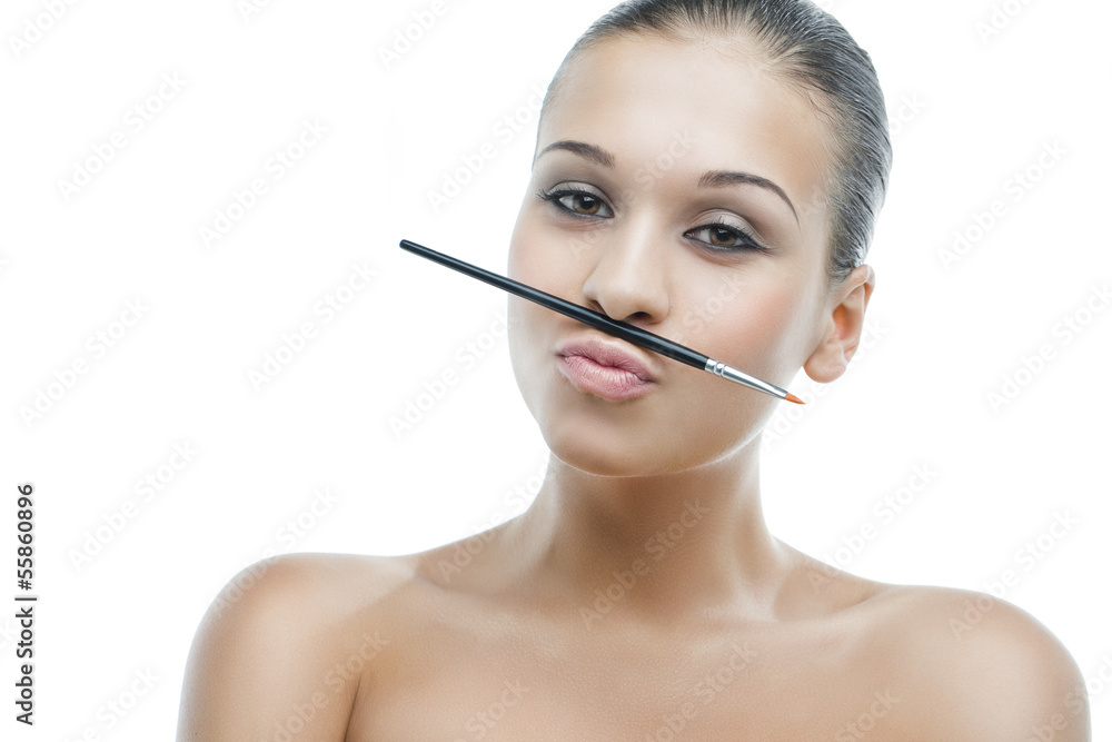young woman doing make-up itself