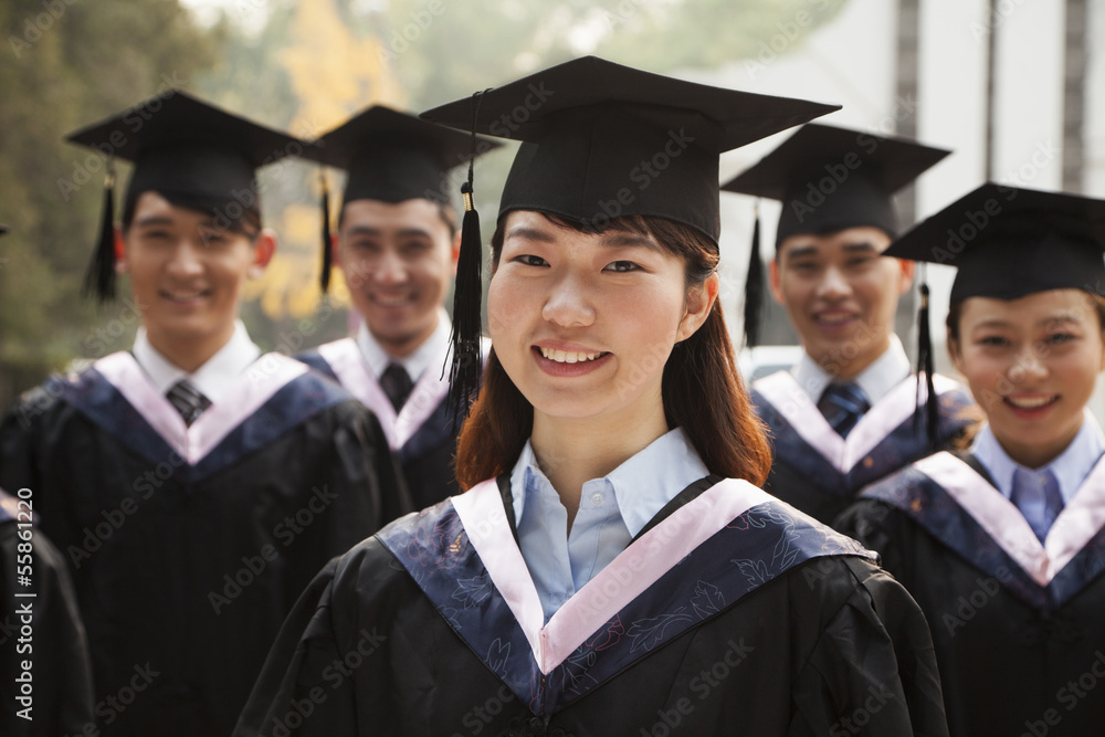 Young Graduates in Cap and Gown Young Graduates in Cap and Gown