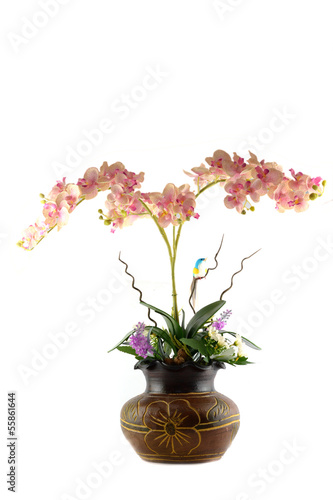 Multicolored flowers in a vase, isolated on white background