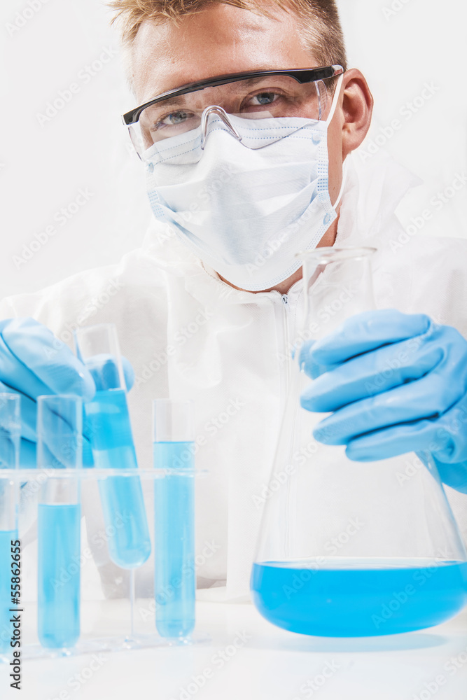 Scientist working in laboratory examining Scientist working in laboratory examining