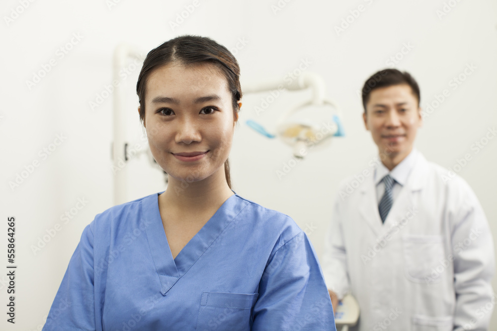 Portrait Of Smiling Female Dental Assistant In Clinic Portrait Of Smiling Female Dental Assistant In Clinic