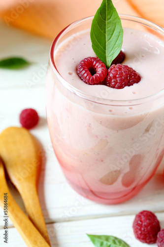 raspberry smoothie milk in a transparent glass