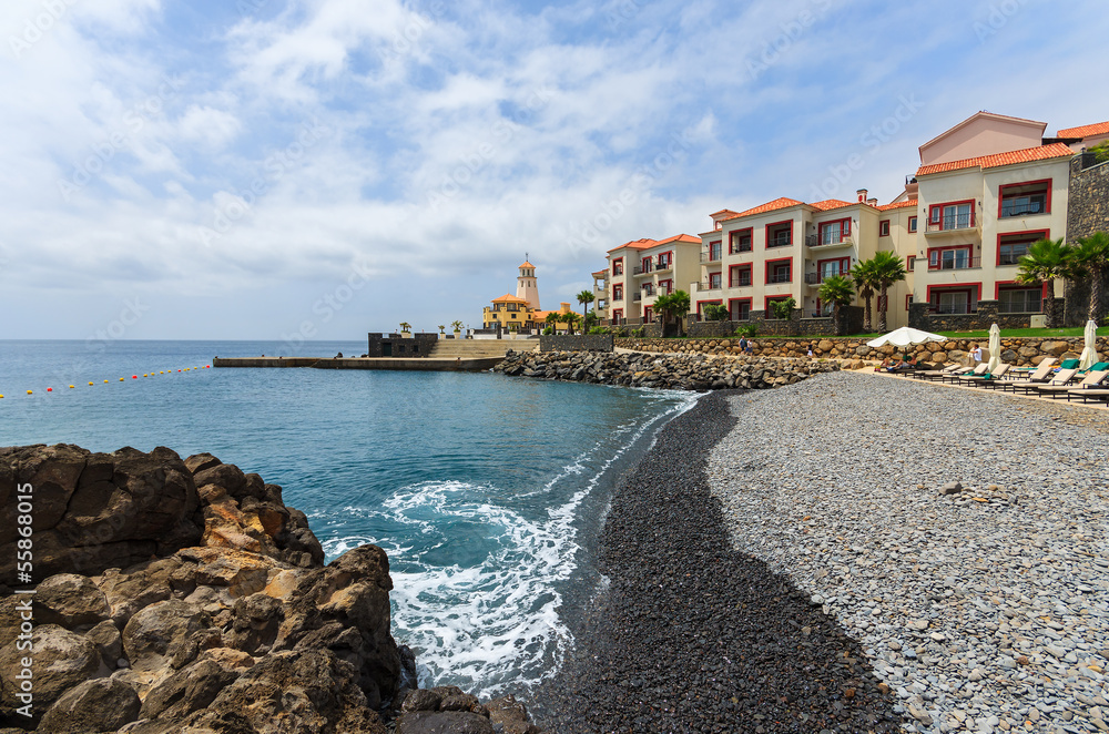 Black stone volcanic beach view promenade, Madeira island