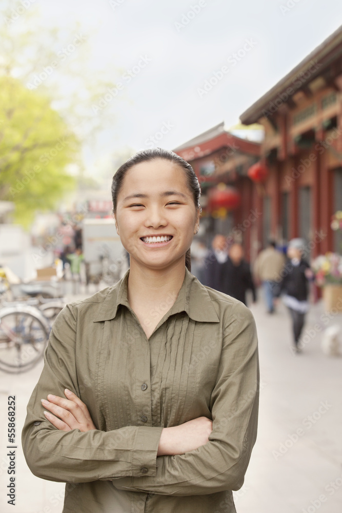 Fototapeta premium Young Woman smiling and looking at camera