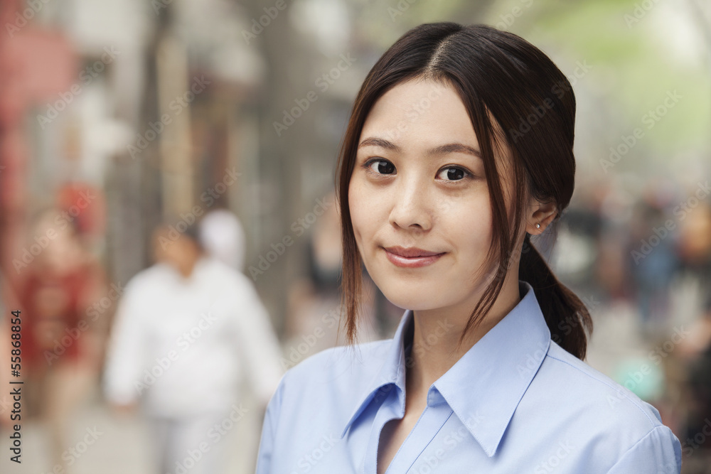 Young Woman smiling and looking at camera Young Woman smiling and looking at camera