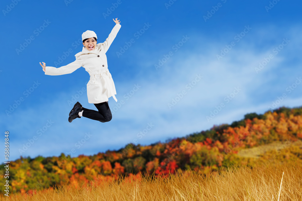 Young Asian woman jumping outdoor Young Asian woman jumping outdoor