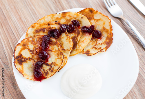 Delicious pancakes with cherry jam