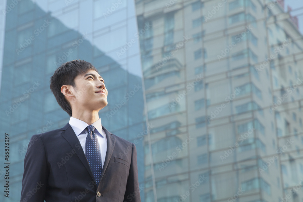 Young Businessman Looking Up, Glass Building, Portrait Young Businessman Looking Up, Glass Building, Portrait