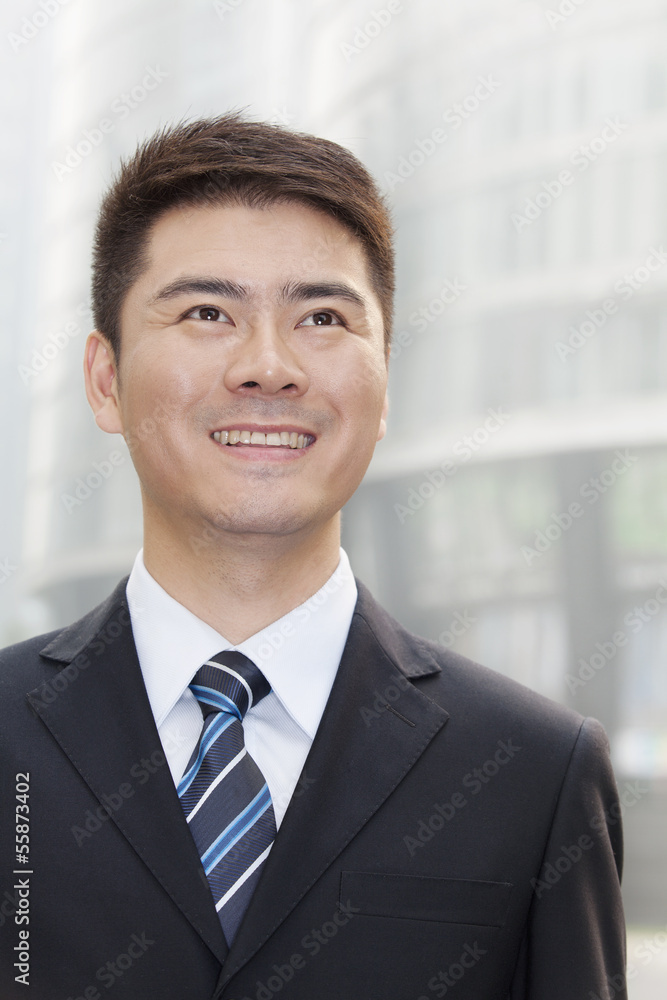 Young Businessman Smiling and Looking Up, Portrait Young Businessman Smiling and Looking Up, Portrait