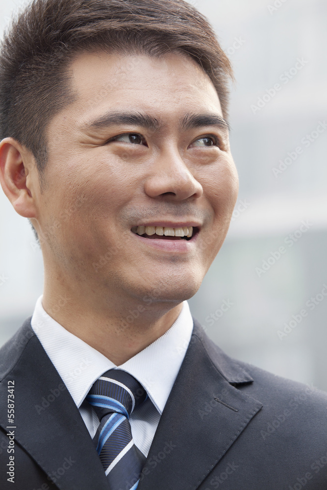 Young Businessman Smiling and Looking Away, Portrait Young Businessman Smiling and Looking Away, Portrait