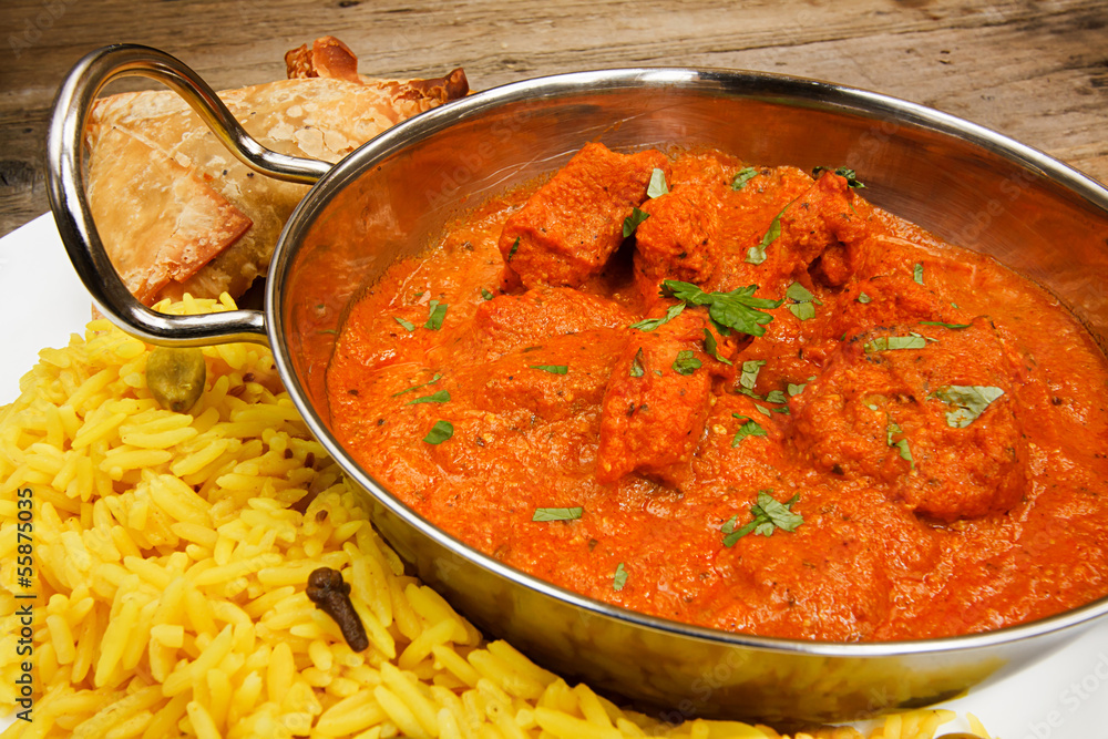Chicken tikka masala in balti dish with rice Chicken tikka masala in balti dish with rice