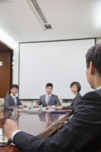 Businesspeople at a Meeting in a Conference Room