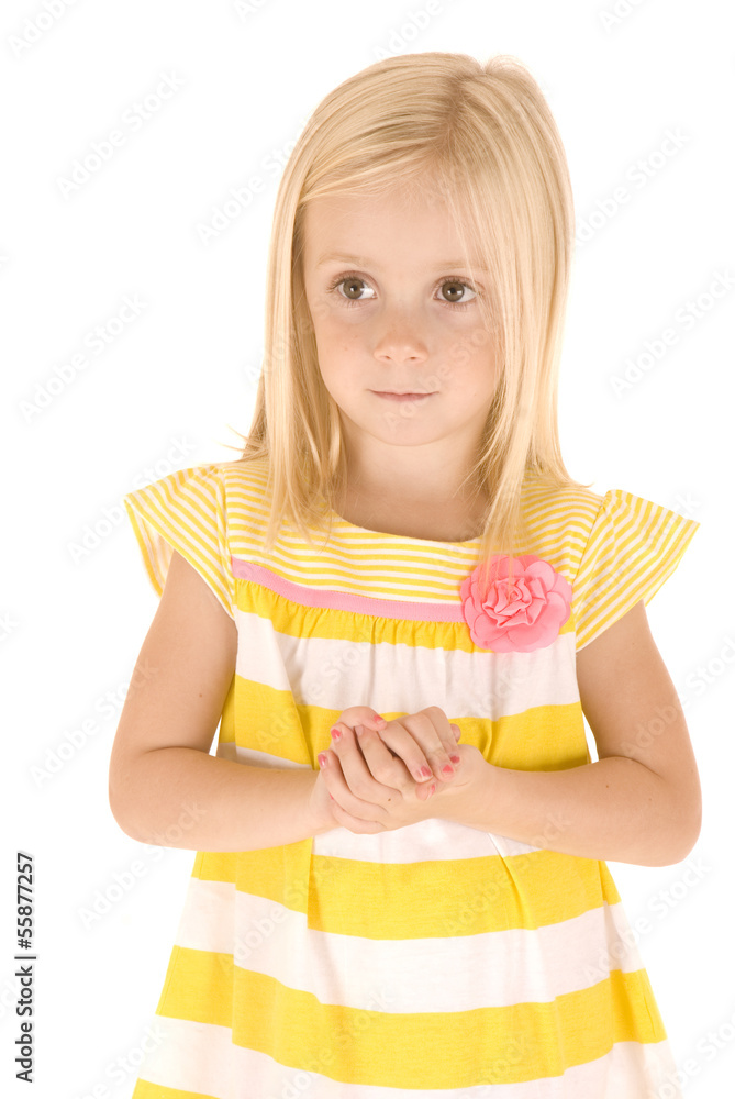 Obraz premium beautiful Young blonde girl with hands folded in yellow shirt