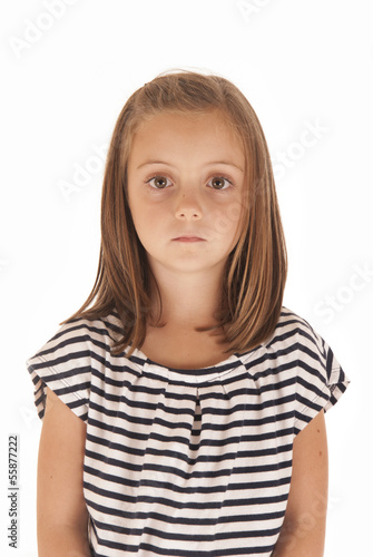 young girl with big eyes in black and white striped shirt with s