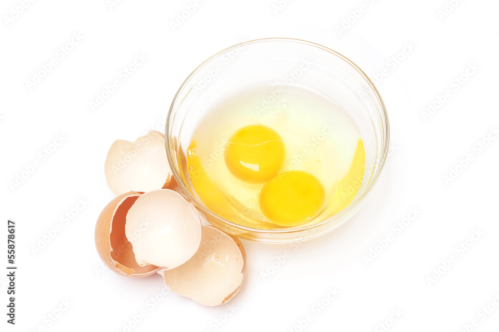 Broken egg in bowl on white background Broken egg in bowl on white background
