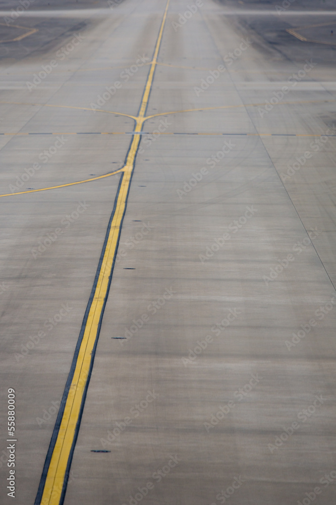 Yellow line on the plane runway in Shanghai Airport Yellow line on the plane runway in Shanghai Airport