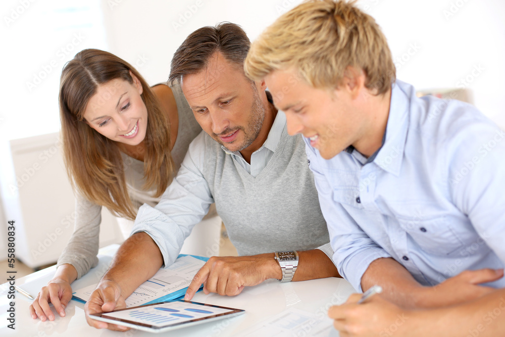 Marketing people working on business plan Marketing people working on business plan