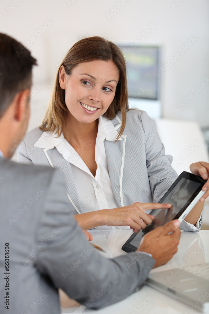 Young woman presenting business plan to financial investor Young woman presenting business plan to financial investor