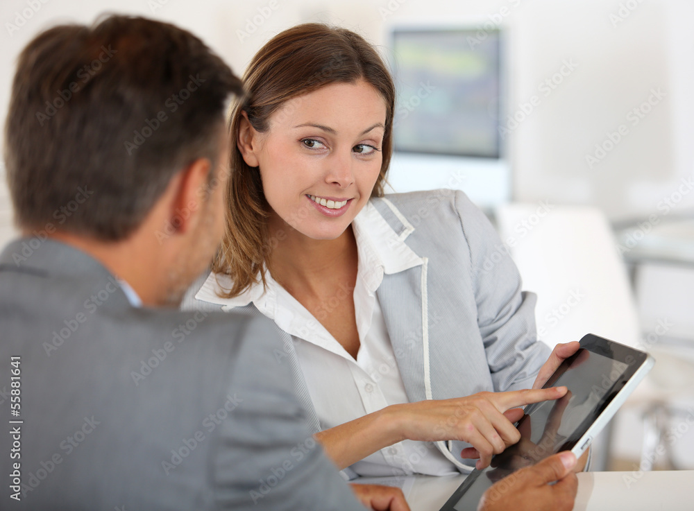 Young woman presenting business plan to financial investor Young woman presenting business plan to financial investor