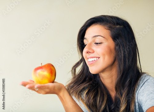 Beautiful woman with an apple