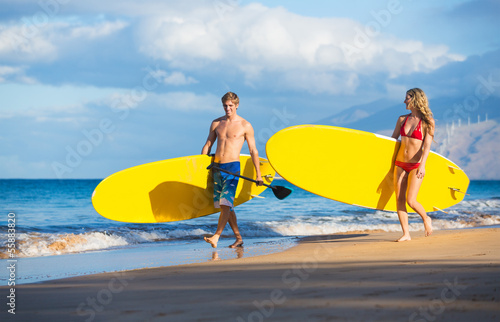 Couple with Stand Up Paddle Boards