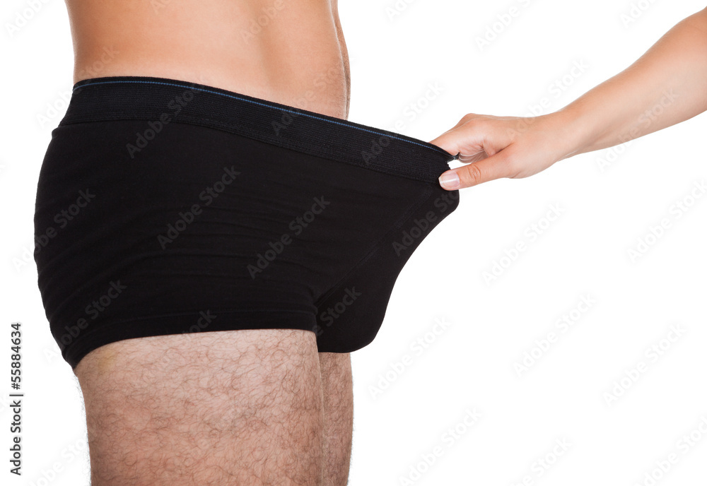 Woman holding man's underwear Stock Photo