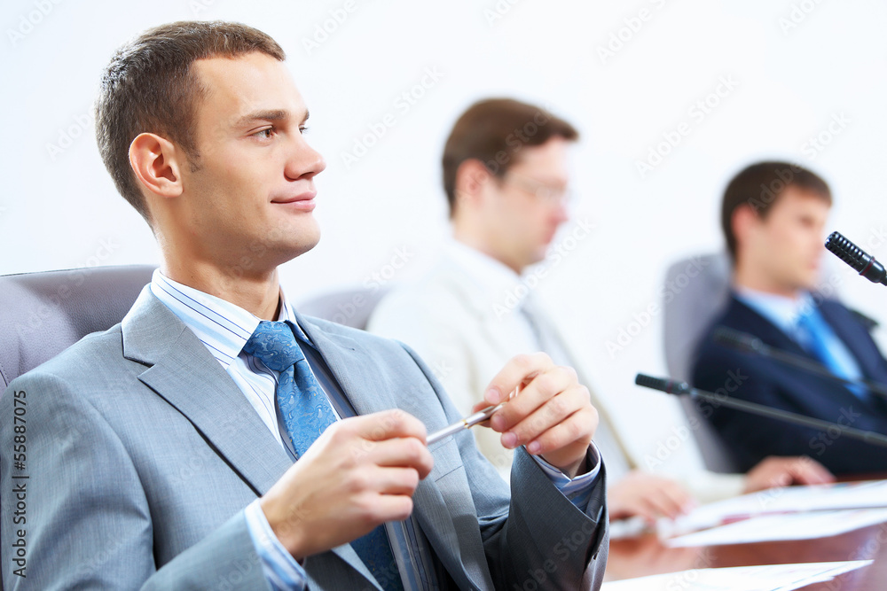 Three businesspeople at meeting Three businesspeople at meeting