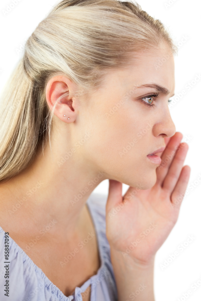 Serious blonde woman telling a secret Serious blonde woman telling a secret