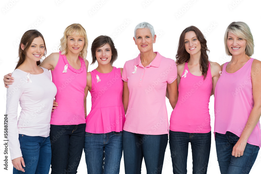 Happy women wearing pink for breast cancer awareness Happy women wearing pink for breast cancer awareness