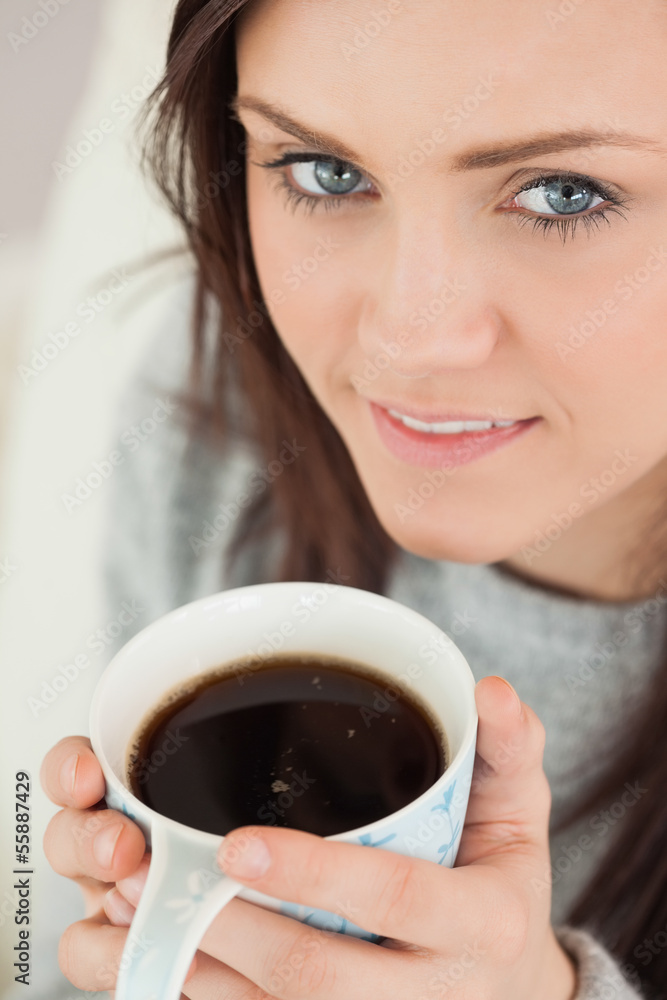 Happy girl holding a cup of coffee Happy girl holding a cup of coffee