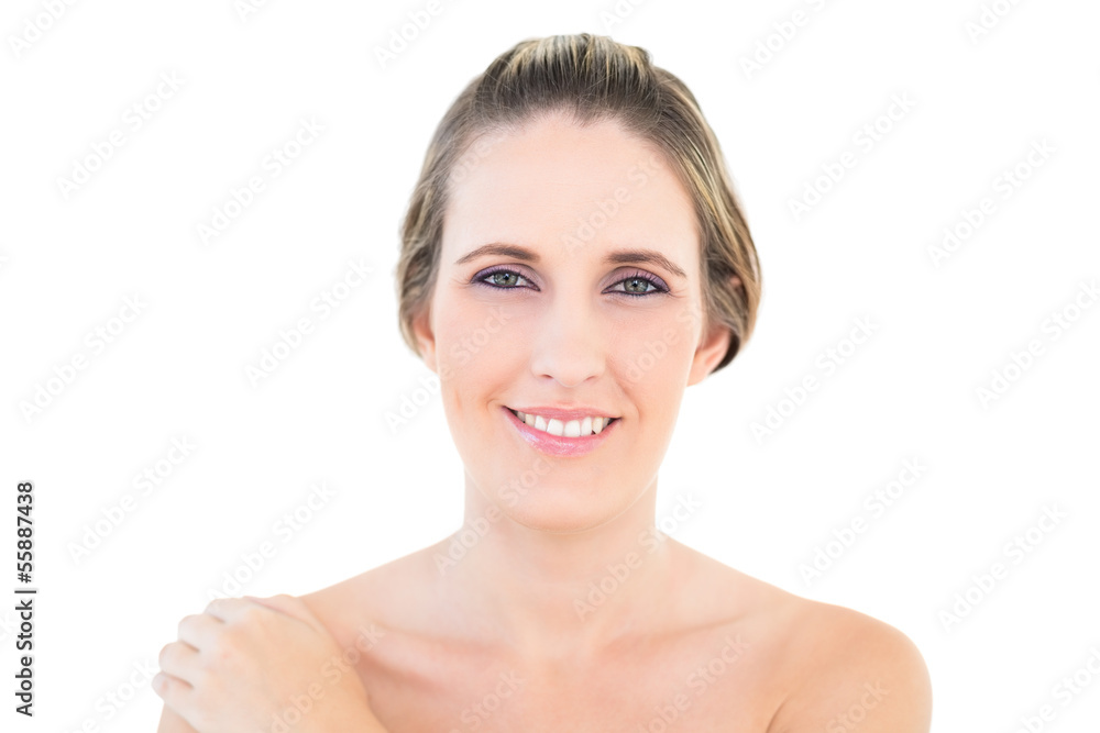 Smiling woman with hand on shoulder looking at camera Smiling woman with hand on shoulder looking at camera