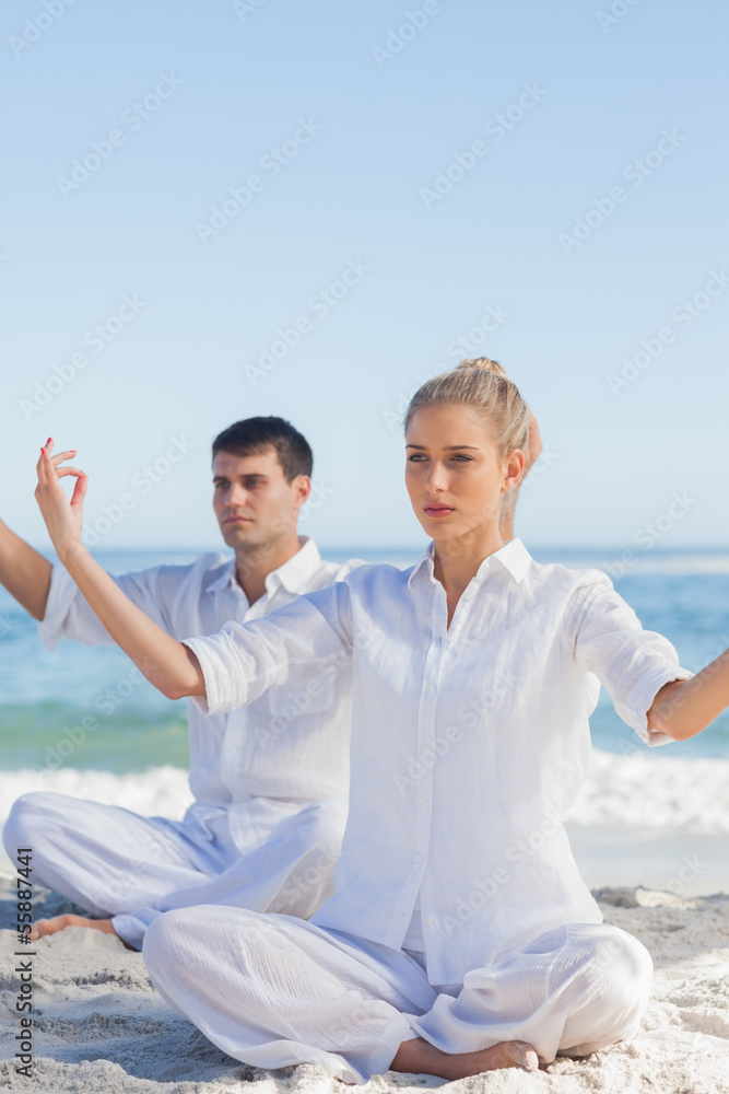 Fototapeta premium Attractive people doing yoga exercises