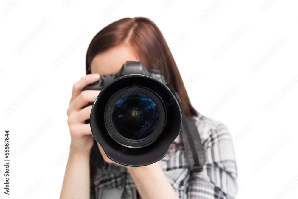 Young casual photographer taking picture of camera Young casual photographer taking picture of camera