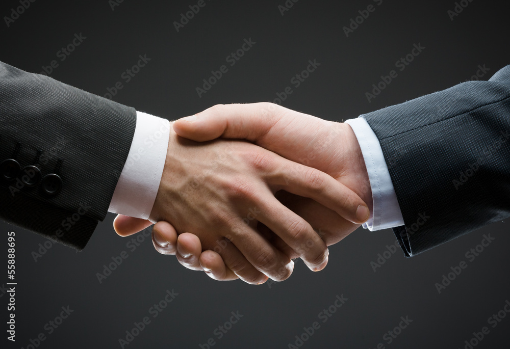Close up of hand shake of business people Close up of hand shake of business people