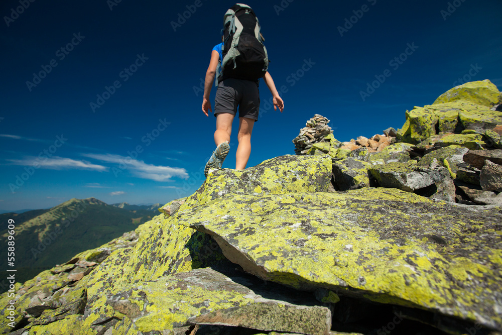 Woman is hiking in Carpathian mountains