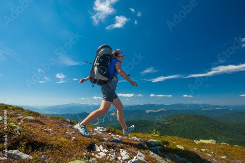 Woman is hiking in Carpathian mountains