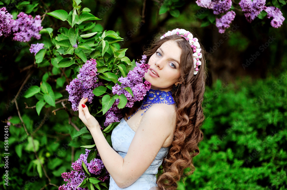 portrait of young woman near the blossoming lilac portrait of young woman near the blossoming lilac