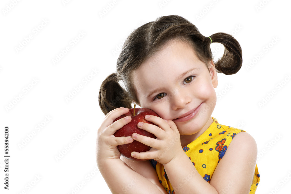 pretty child holding a red apple in her hands