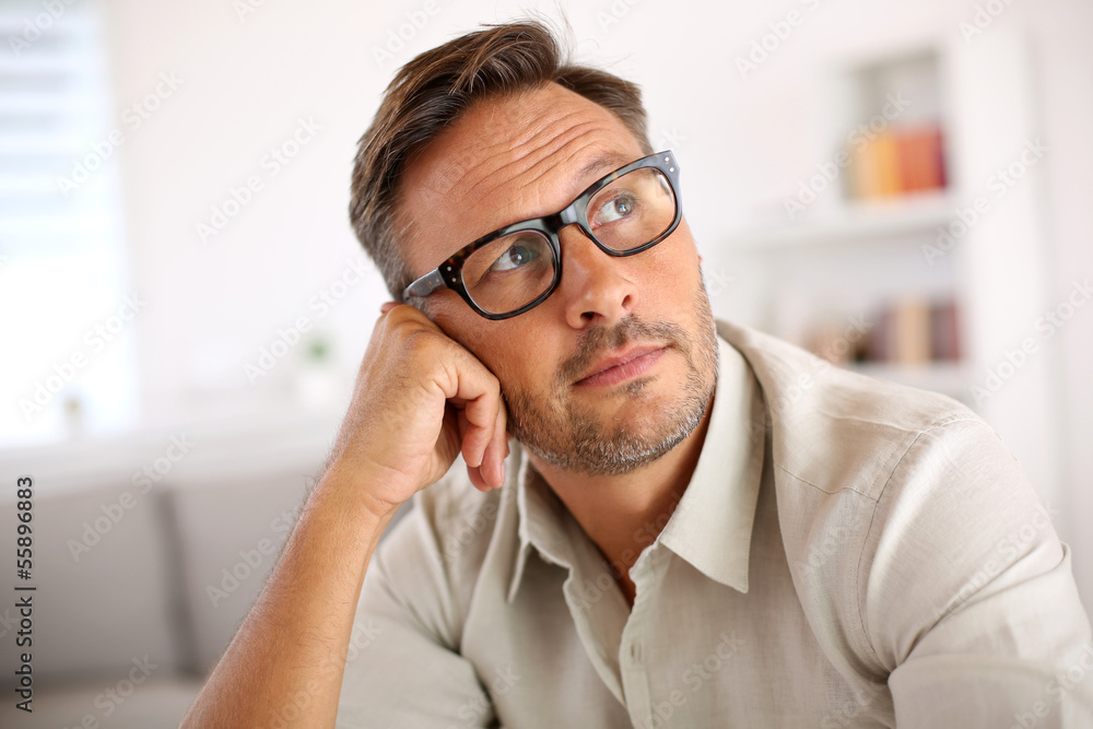 Man with eyeglasses being thoughtful Man with eyeglasses being thoughtful