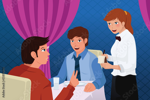 Waiter in a restaurant serving customers