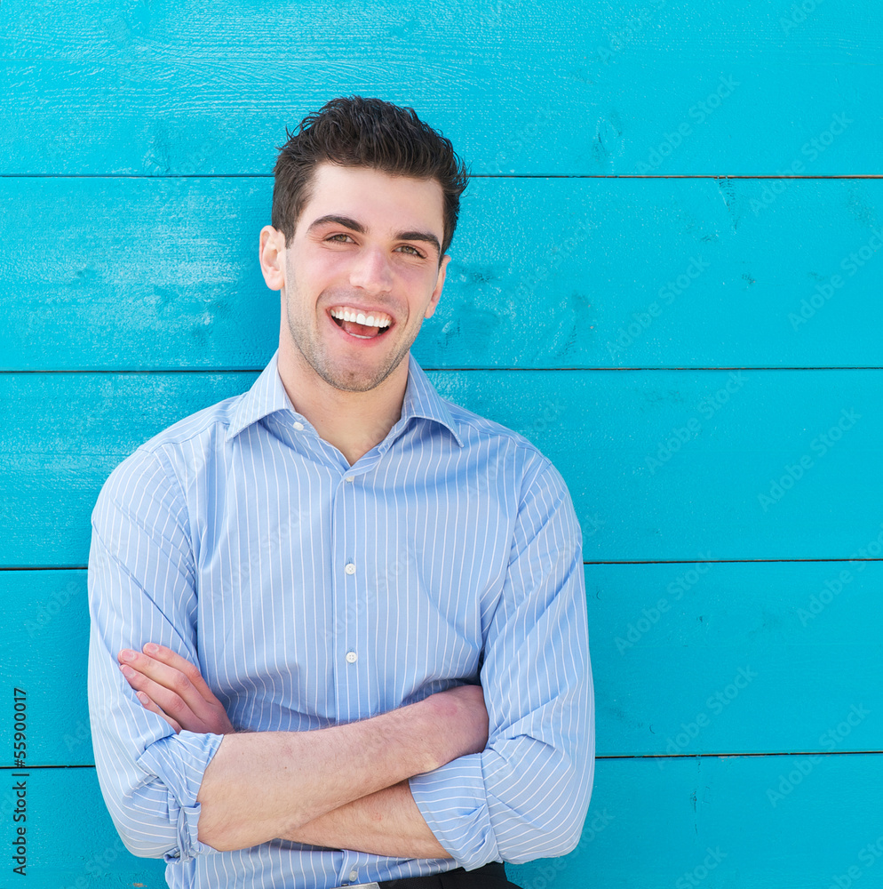Attractive male model laughing outdoors Attractive male model laughing outdoors