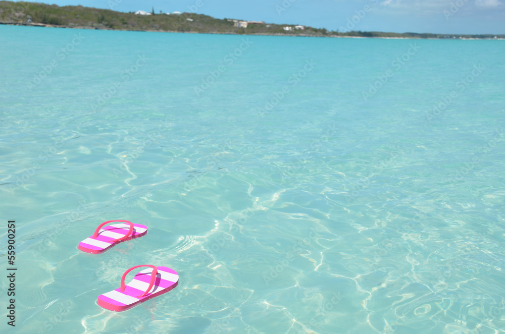 Flip-flops in the water. Great Exuma, Bahamas Flip-flops in the water. Great Exuma, Bahamas