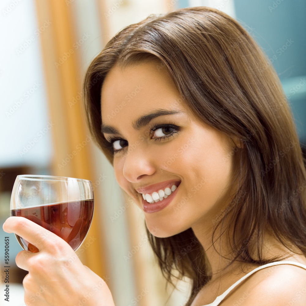 Young woman with glass of redwine Young woman with glass of redwine