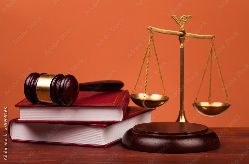 judge gavel,books and scales of justice on table judge gavel,books and scales of justice on table