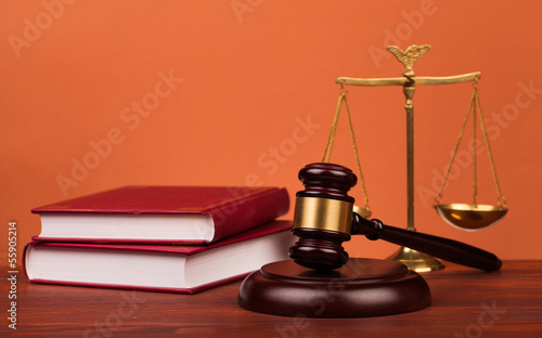 judge gavel and scales of justice on table