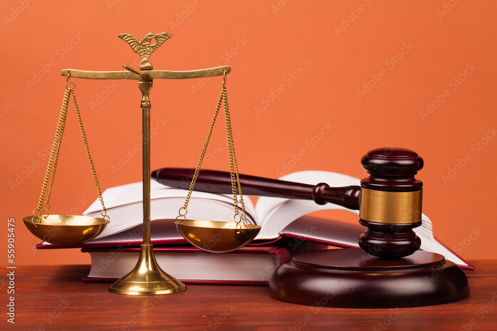 judge gavel,books and scales of justice on table judge gavel,books and scales of justice on table