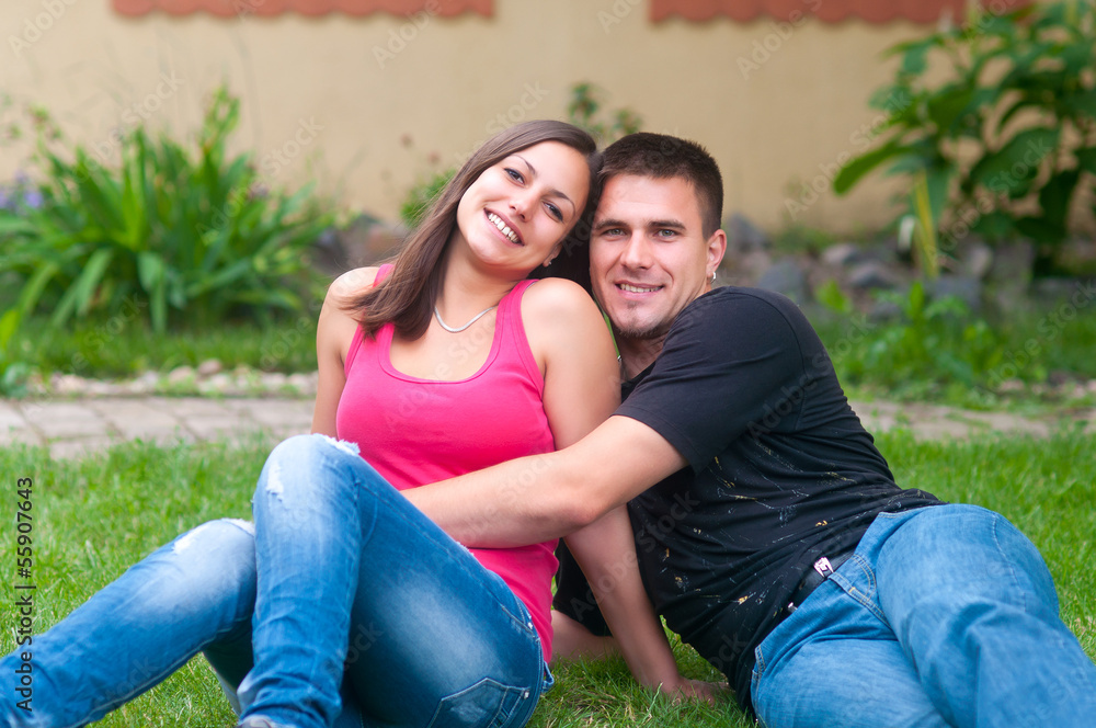 Young couple having fun in the garden Young couple having fun in the garden