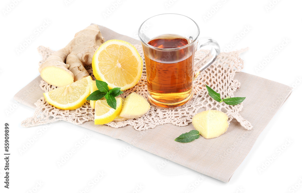 Cup of tea with ginger on napkin isolated on white Cup of tea with ginger on napkin isolated on white