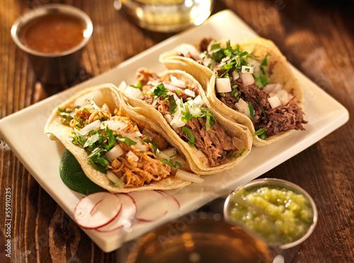 authentic mexican barbacoa, carnitas and chicken tacos photo